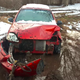 My Kia no longer sits in a mud pit, but it is still immobile and in my backyard.